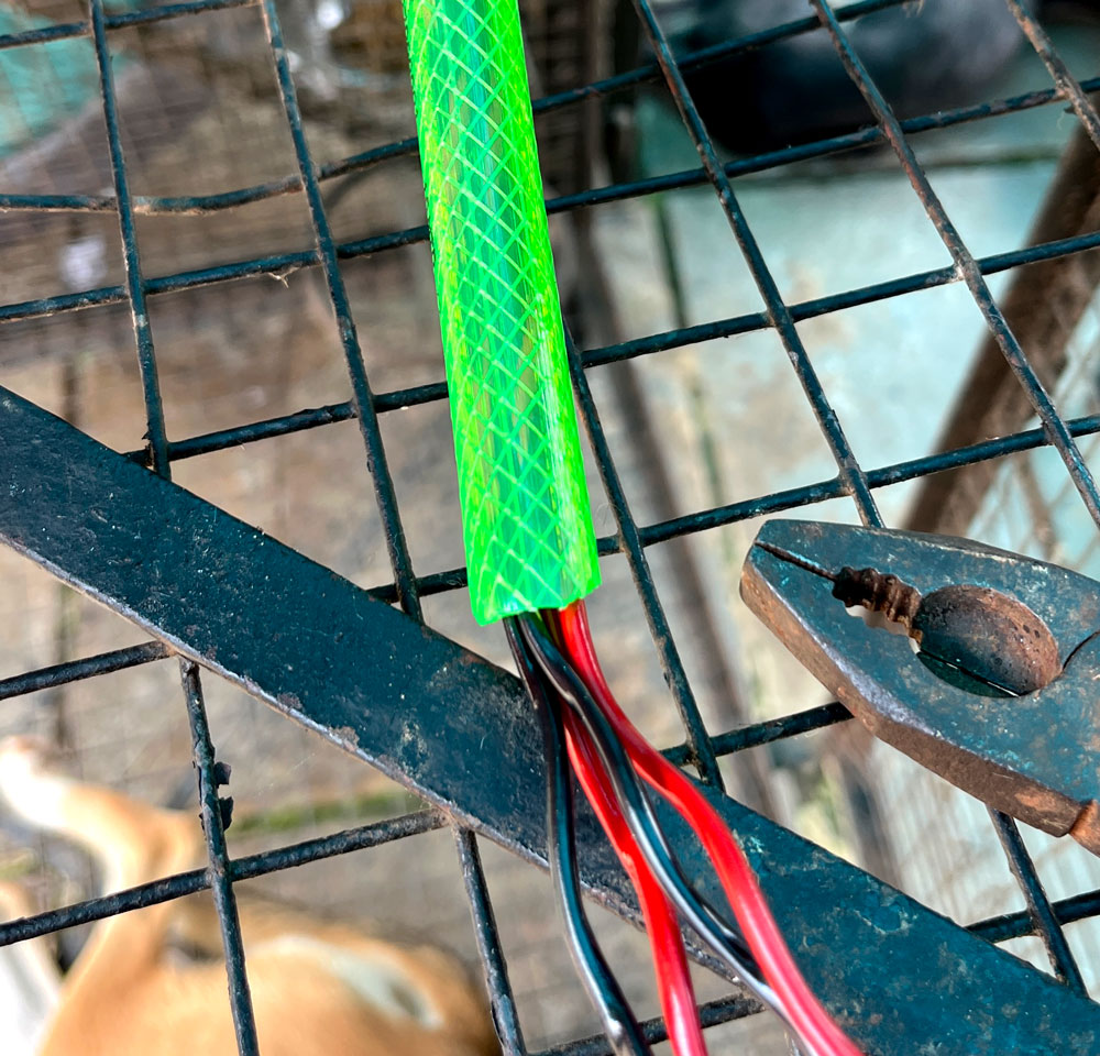 Cables poked through garden hose